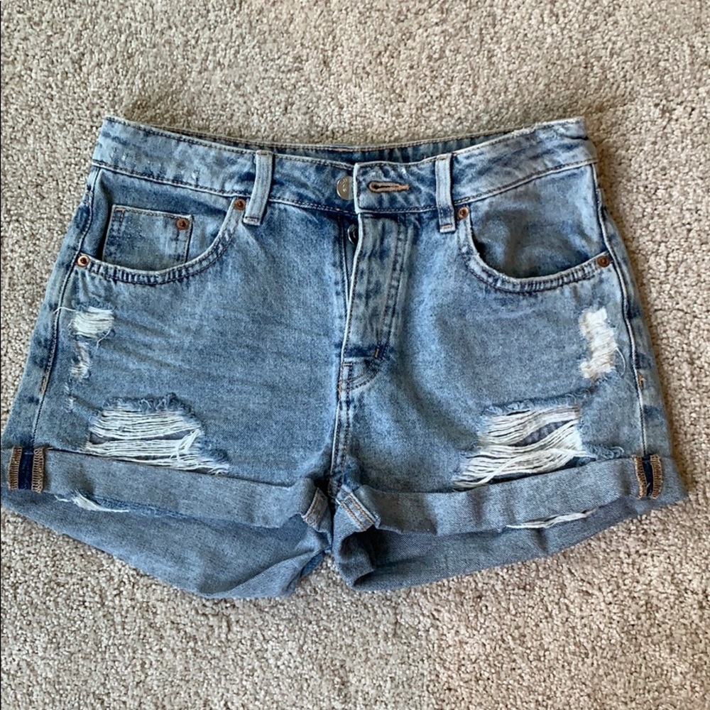 Ripped blue jean shorts